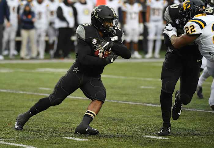 Nov 23, 2019; Nashville, TN, USA; Vanderbilt Commodores running back Ke'Shawn Vaughn (5) runs for a short gain during the first half against the East Tennessee State Buccaneers at Vanderbilt Stadium.
